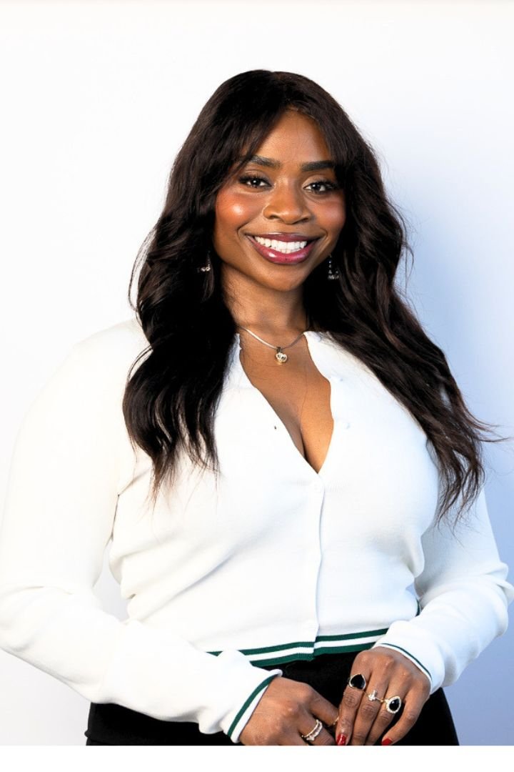 Lira Ndifon smiling in a white blouse